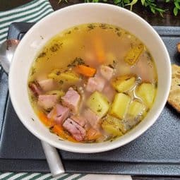 Smoked Hambone soup in bowl with spoon