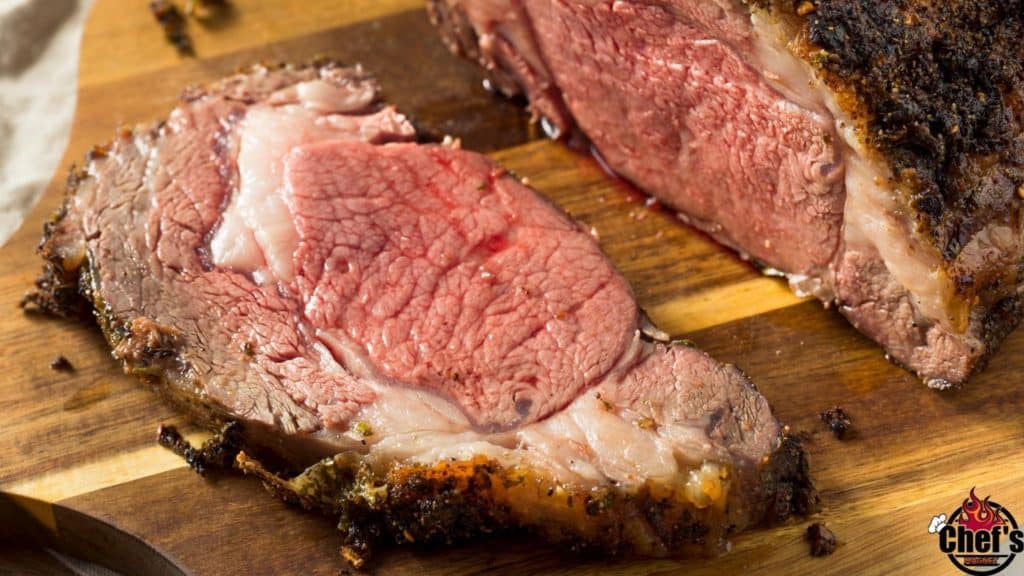 Sliced rib roast on cutting board 