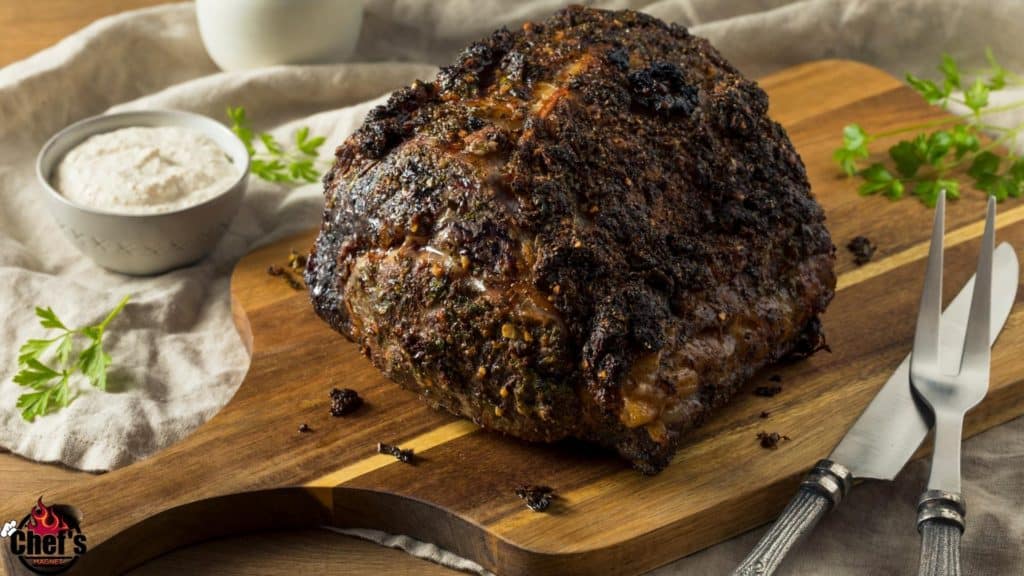 Seared rib roast unsliced on wood cutting board 