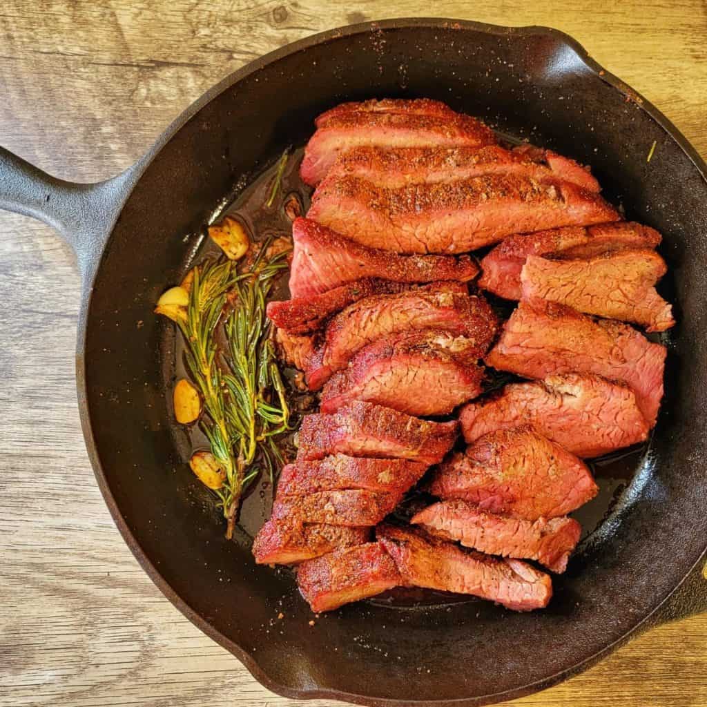 Sliced tri-tip in pan ready for serving