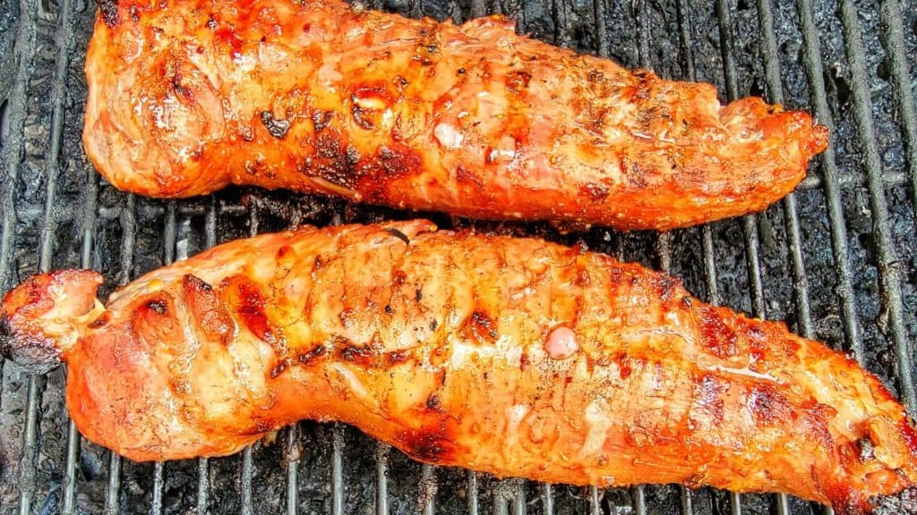 Grill marks shown on pork tenderloins on the pellet grill