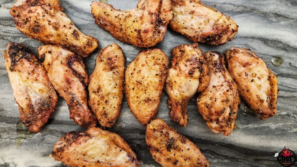 Smoked Lemon Pepper Chicken Wings in Glaze on marble